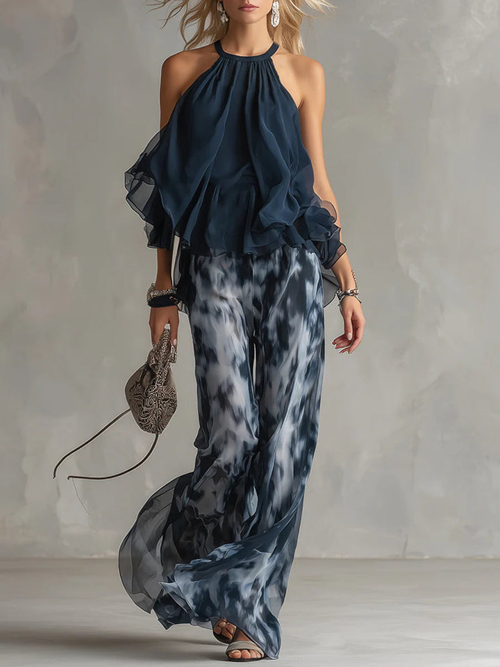 Top con collo all'americana navy e set di pantaloni larghi stampati in chiffon